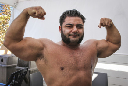 Vegan strongman Patrik Baboumian breaks a world record by carrying 555 kilos 10 metres on the West Jet stage at the Harbourfront Centre
